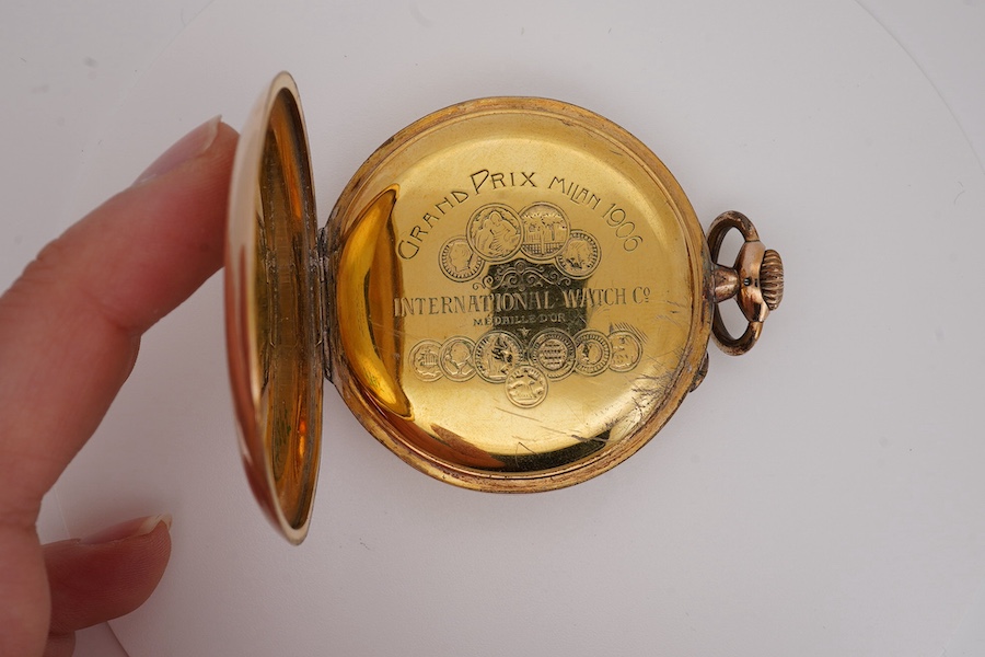 An engine turned gilt metal IWC open faced keyless dress pocket watch, with Arabic dial and subsidiary seconds, case diameter 51mm. Condition - fair to good